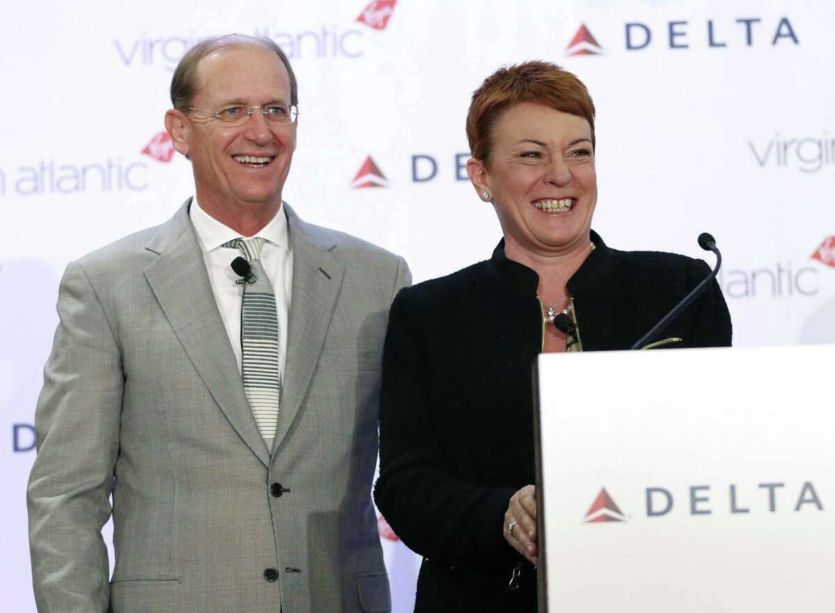 Delta CEO Richard Anderson and Virgin Atlantic official Julie Southern announce the deal that will give Delta a bigger share of flights to London.