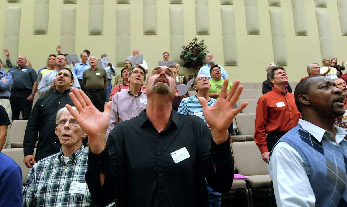 Mark Watts, who sings tenor, joins others in the Community Bible Church choir as they rehearse for the upcoming Christmas pageant, called "Love Came Down," which will be performed on December 15-16 at the church.