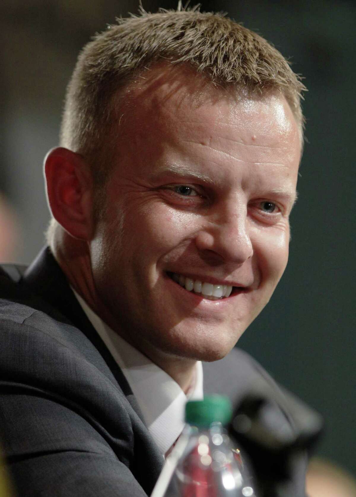NCAA college football coach Bryan Harsin speaks at a news conference in Jonesboro, Ark., Wednesday, Dec. 12, 2012. The former Texas co-offensive coordinator has been hired as Arkansas State's new head coach.(AP Photo/Danny Johnston)