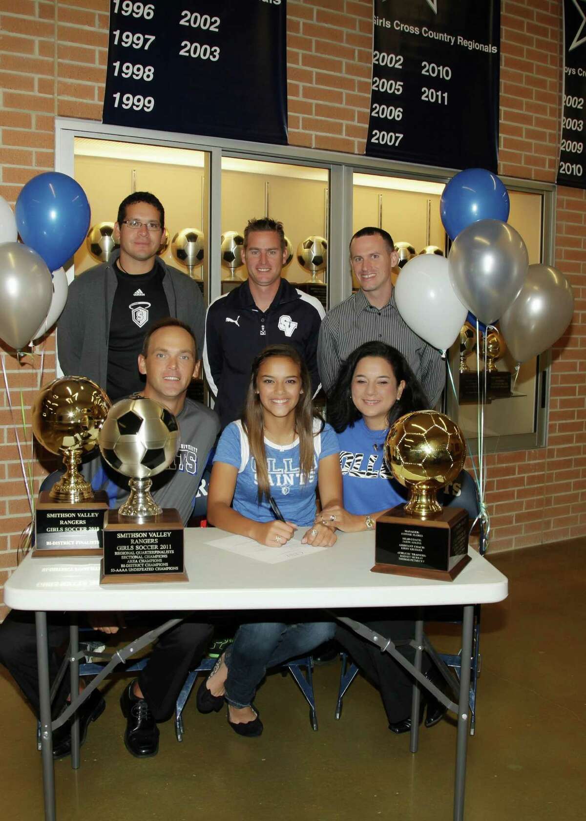 Smithson Valley High senior Pauline Fields signed her letter of intent Dec. 7 to play soccer at Our Lady of the Lake University. Pictured in the front row (l-r) are her father, Michael Fields, Fields and her mother Lisa. In the back row are Our Lady of the Lake soccer coach Arthur Salazar, SVHS girls soccer coach Jason Adkins and club soccer coach Robbie Babcock.