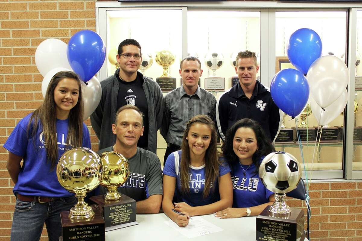 Smithson Valley High senior Pauline Fields signed her letter of intent Dec. 7 to play soccer at Our Lady of the Lake University. Pictured in the front row (l-r) are her sister, Annika Fields, father Michael Fields, Fields, and mother Lisa Fields. In the back row are Our Lady of the Lake soccer coach Arthur Salazar, club soccer coach Robbie Babcock and Smithson Valley High girls soccer coach Jason Adkins.