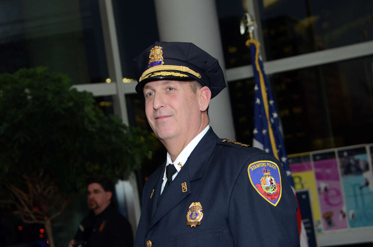Stamford Police Chief Jon Fontneau proudly wears his Chief hat after being sworn in at the Stamford Government Center on Thursday, Dec. 13, 2012.