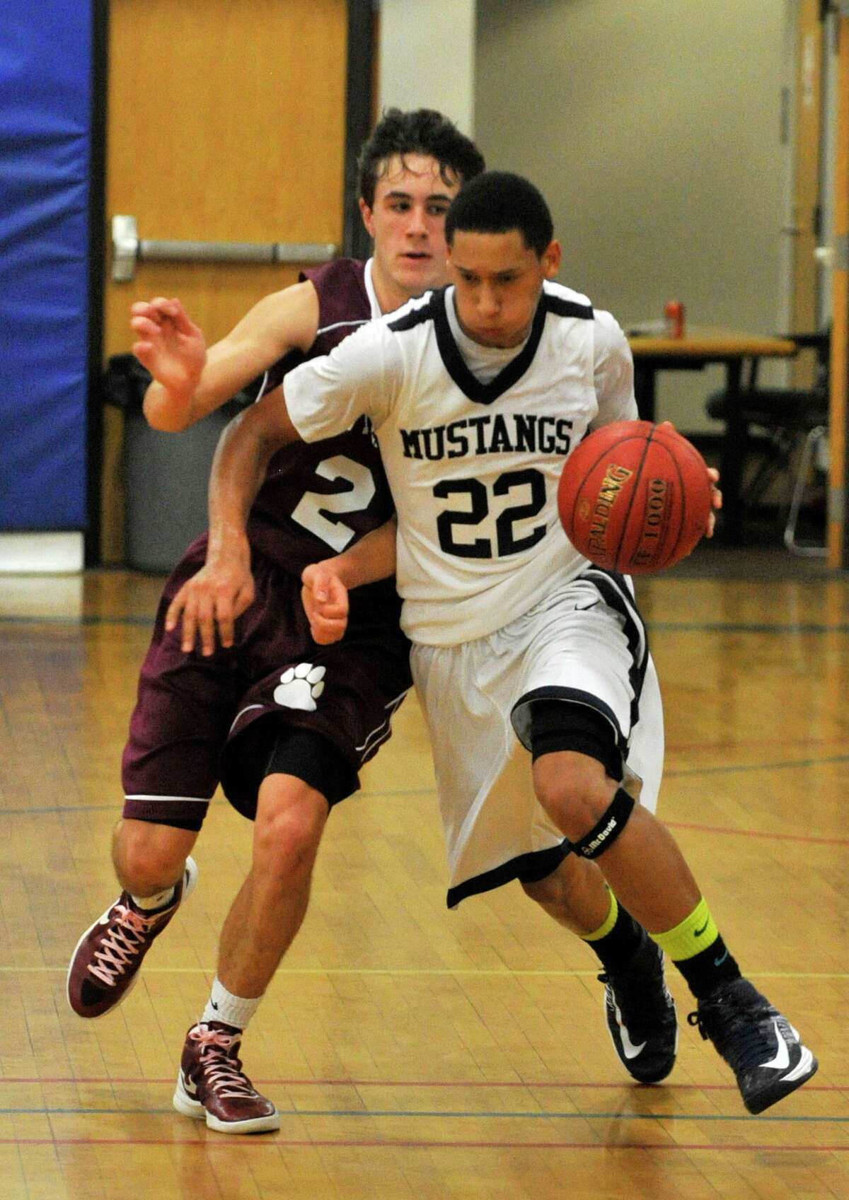 Immaculate's Joey Wallace dribbles up the floor while under pressure from Bethel's Frankie Magrone during their game in the first round of The News-Times Greater Danbury Tip-Off Classic at the Danbury War Memorial on Thursday, Dec. 13, 2012. Bethel advanced to the next round beating Immaculate 67-52.
