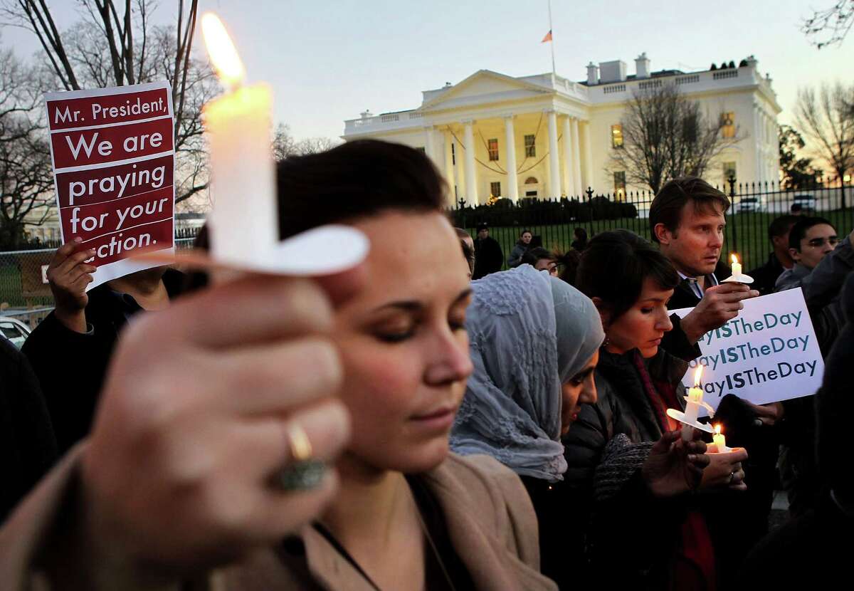 WASHINGTON, DC - DECEMBER 14: People gather outside the White House to participate in a candle light vigil to remember the victims at the Sandy Hook Elementary School shooting in Newtown, Connecticut on December 14, 2012 in Washington, DC. According to reports, there are about 27 dead, 18 children, after a gunman opened fire in at the Sandy Hook Elementary School. The shooter was also killed.