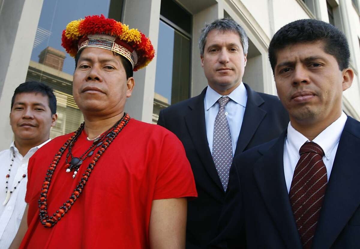 Left to right, Ecuadorans Guillermo Grefa and Humberto Piaguaje stand with their legal team Steven Donziger and Pablo Fajardo before a news conference in San Francisco, Calif. on Tuesday, April 24, 2007. The group will press their issue to Chevron shareholders this week bringing to light their accusations that Texaco, acquired by Chevron a fews years back, contaminated an Amazon rain forest region several decades ago.