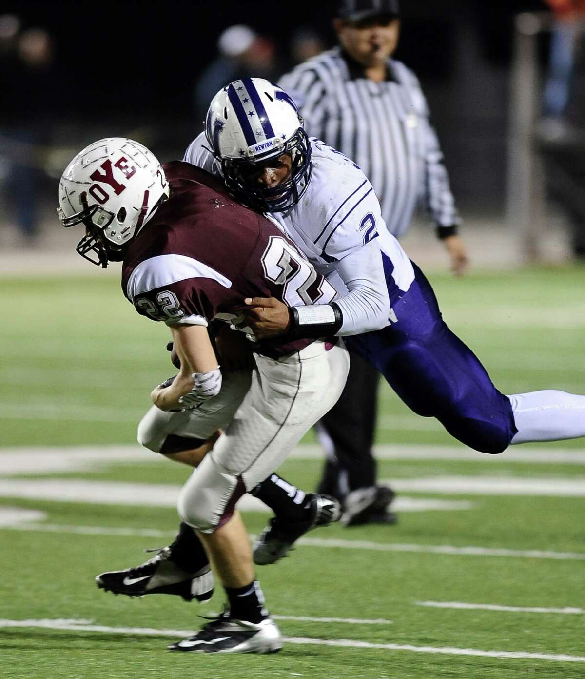 Newton defensive back Dale Dean, #2, takes down Yoemen Jay'lon Bryant, #22, during the Newton High School Class 2A Division I state semifinal game against Cameron Yoe at the Woodforest Bank Stadium in Shenandoah, TX on December, 14, 2012. Photo taken: Randy Edwards/The Enterprise