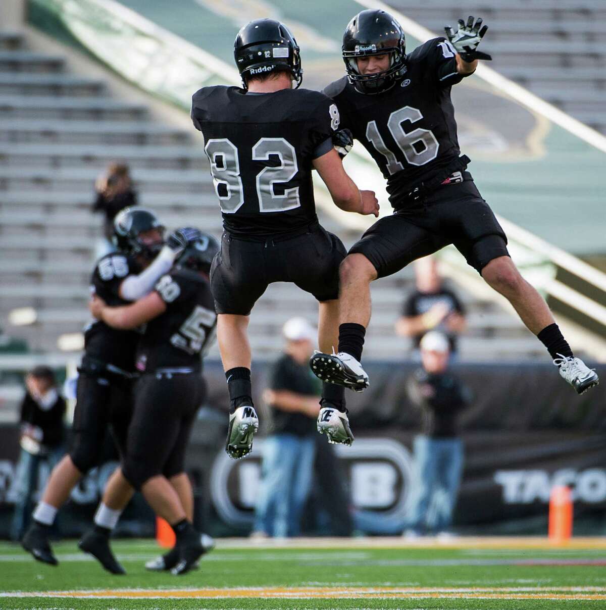 Cibolo Steele defensive back Tyler Petoskey (16) and tight end Matthew Moen (82) celebrate after the Knights recovered a Katy fumble during the second quarterin a Class 5A Division II state high school football semifinal game at Floyd Casey Stadium on Saturday, Dec. 15, 2012, in Waco. ( Smiley N. Pool / Houston Chronicle )