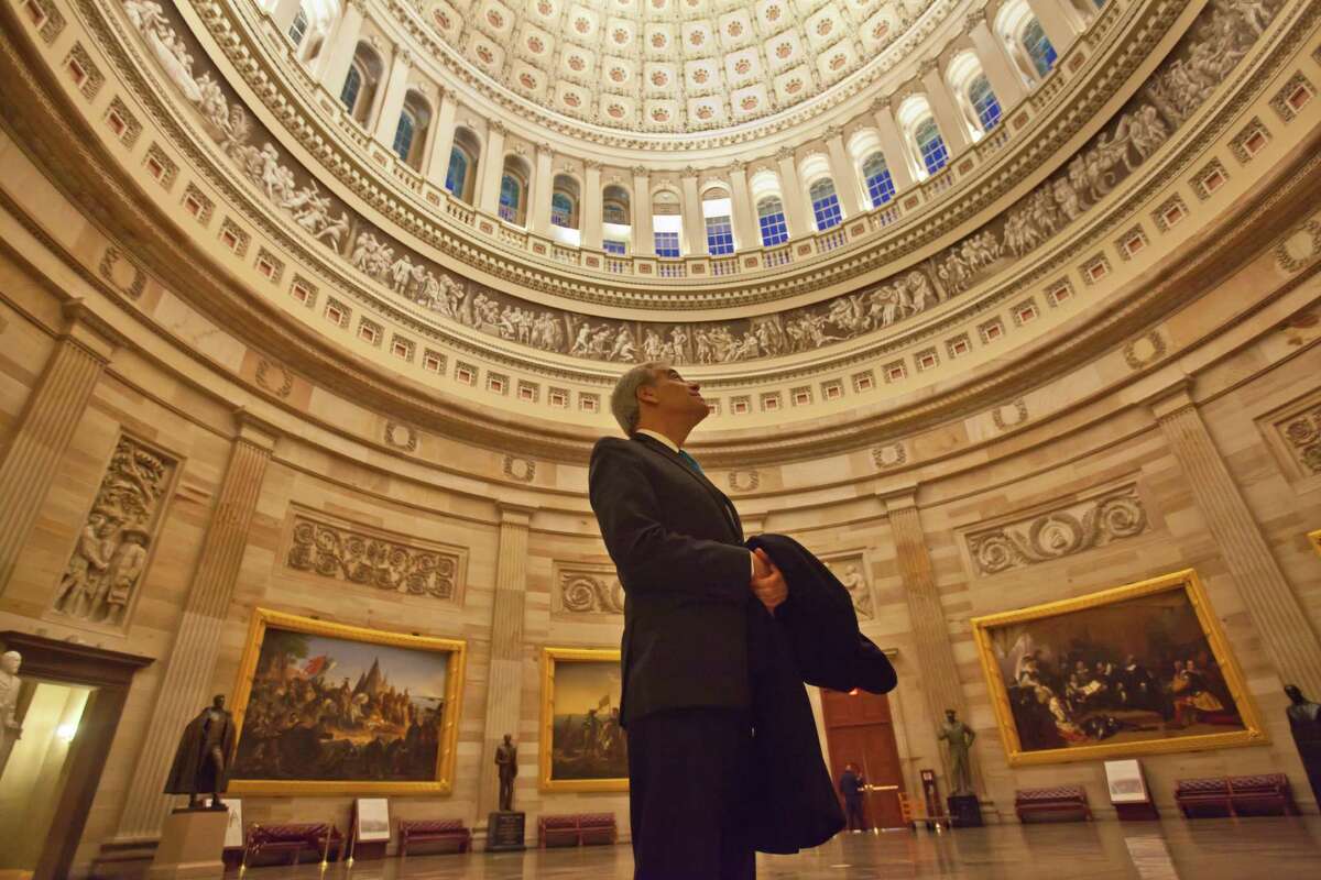 U.S. Rep. Charlie Gonzalez, D-San Antonio, pauses to gaze up at the Capitol Rotunda on one of his final days as a member of Congress. He was first elected to the House of Representatives in 1998.