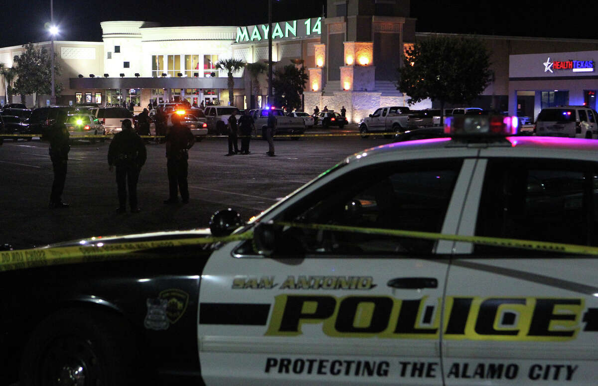 San Antonio Police stand guard near the Mayan 14 Theatres after an incident Sunday night, Dec. 16, 2012.