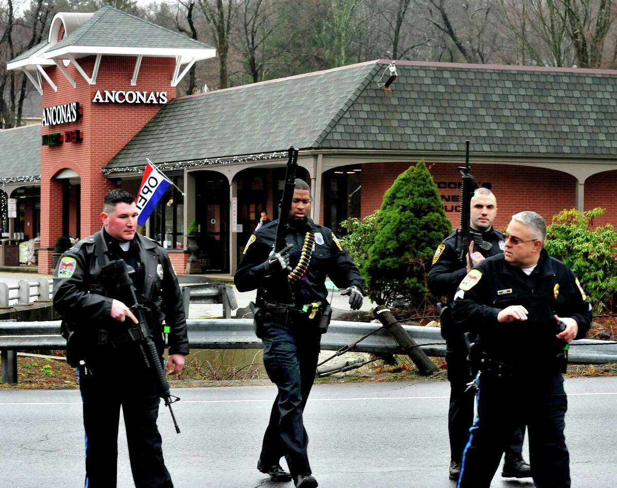 Norwalk Police respond to a report of a man carring a rifle at the Branchville Train Station in Ridgefield Monday, Dec. 17, 2012. The report turned out to be false, police said.