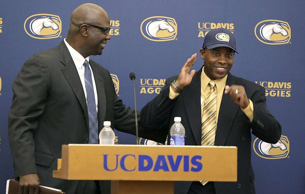 New UC Davis head coach Ron Gould, right, is introduced by athletic director Terry Tumey during an NCAA college football news conference, Monday, Dec. 17, 2012, in Davis, Calif. Gould, the former California running game coordinator, was introduced to replace Bob Biggs, who retired after the 2012 season. (AP Photo/The Davis Enterprise, Wayne Tilcock)
