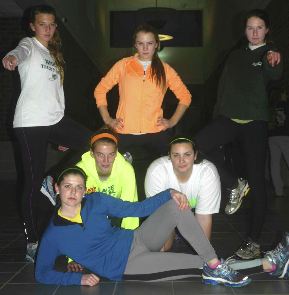 Green Wave captains Meghan Dietter, foreground; from left to right, Ali Rettenmeier and Susie Baldwick, and, back row, Sierra Grazia, Claire Brofford and Kayla Nelson show attitude as they pose for posterity in advance of the New Milford High School girls' indoor track season. Absent from the photo is fellow captain Sofia Amaral.. December 2012