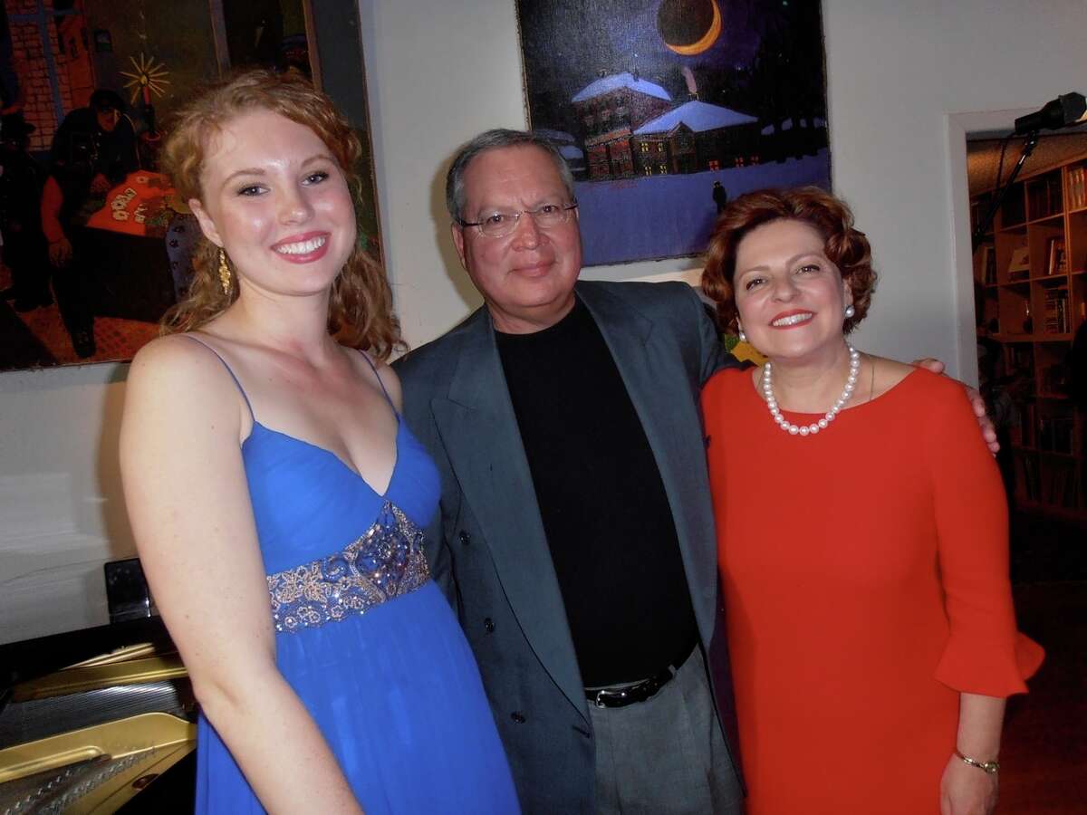 After a home concert benefiting Musical Bridges Around the World, Canadian mezzo-soprano Carolyn Sproule, from left, and French concert pianist Hugues Leclre visit with host and Musical Bridges Artistic Director Anya Grokhovski-Michaelson.