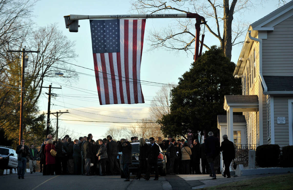 People arrive to the the funeral of Sandy Hook principal Dawn Lafferty Hochsprung at the Munson Lovetere funeral home in Woodbury on Wednesday, Dec. 19, 2012.