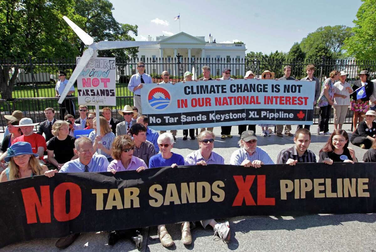Environmental activists gather outside the White House last year to protest the Keystone XL pipeline project.