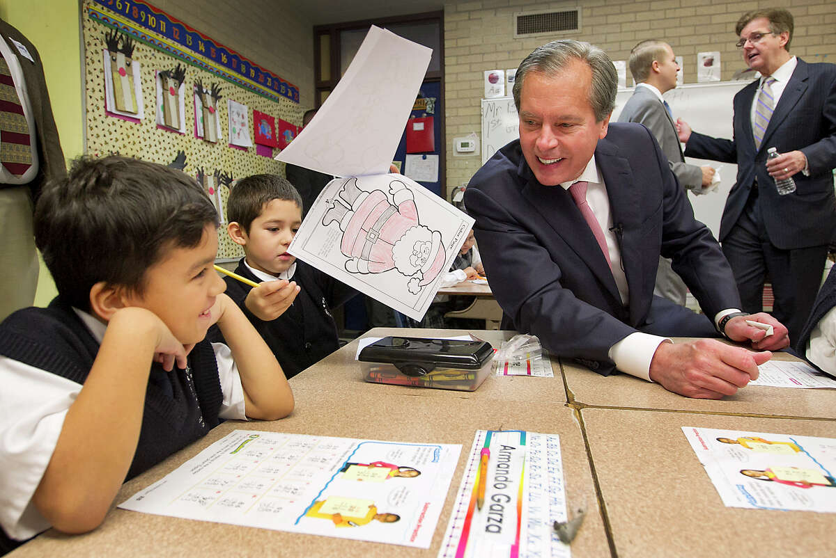 Lt. Gov. David Dewhurst visits with pupils after a news conference Wednesday at the Cathedral School of Saint Mary in Austin.