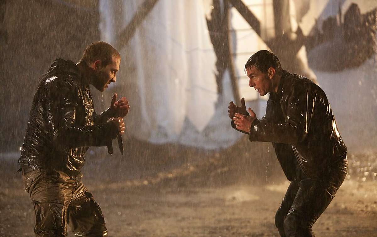 This undated publicity photo released by Paramount Pictures shows Tom Cruise, right, as Reacher and Jai Courtney as Charlie in the film, "Jack Reacher." (AP Photo/Paramount Pictures, Karen Ballard)