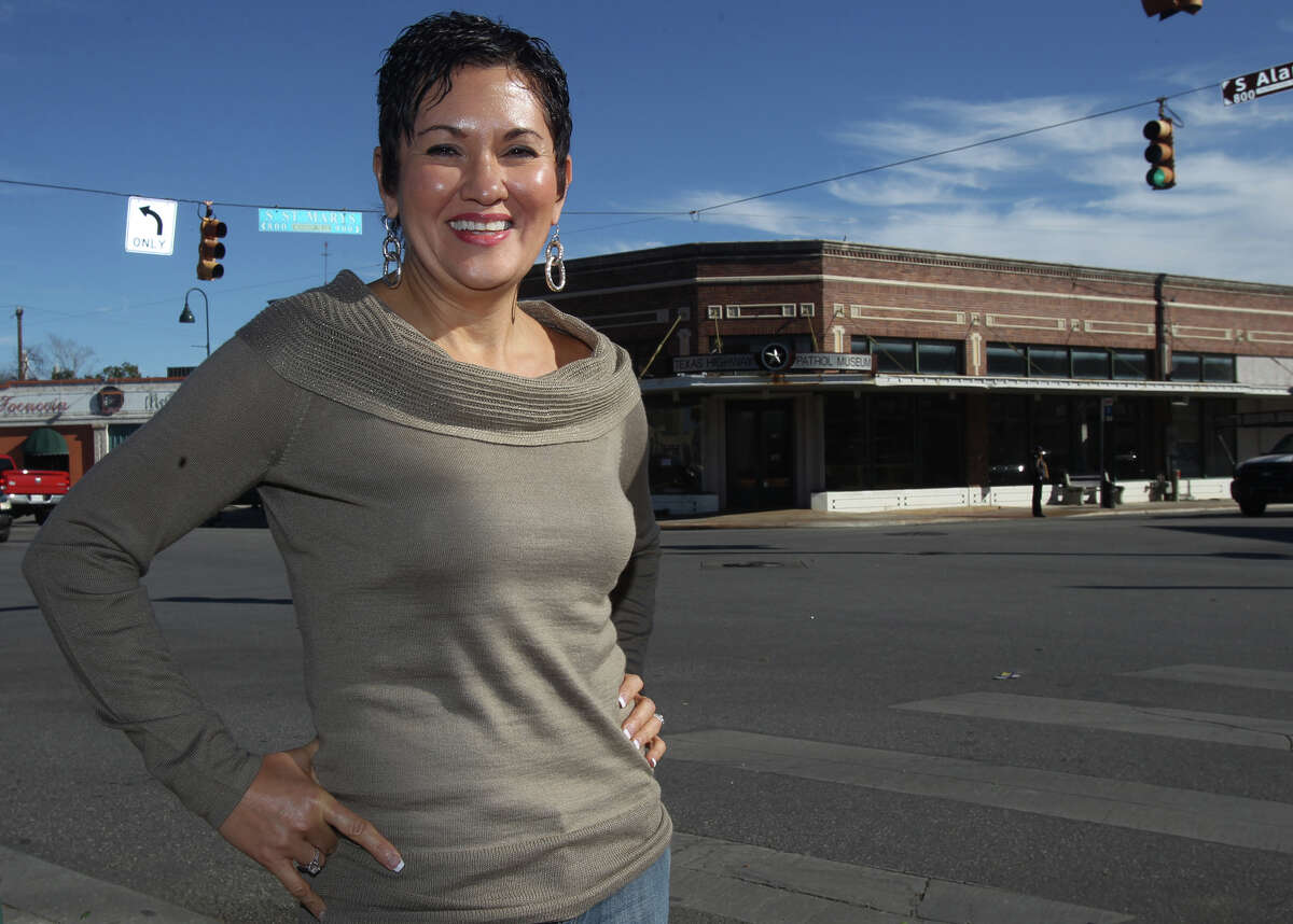 Rosario's restaurant owner Lisa Wong stands across the street from the old Texas Highway Patrol Museum Thursday December 20, 2012. Wong plans to file a court motion in Travis County to request a hearing about the sale of the Texas Highway Patrol Museum property.
