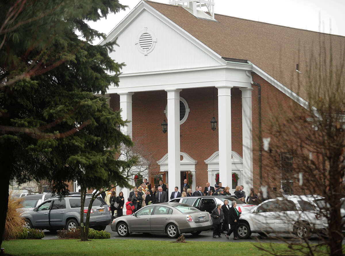 Mourners exit the funeral of James R. Mattioli, one of the children killed in the Sandy Hook Elementary School shootings, at St. Rose of Lima Catholic Church in Newtown on Tuesday, December 18, 2012.