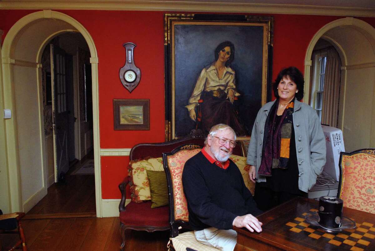 Kenneth and Elizabeth Lange at home in Stamford, Conn. on Friday December 21. 2012, behind them is a portrait of Elizabeth done by Jan DeRuth who had also painted a portrait of Jackie Kennedy.