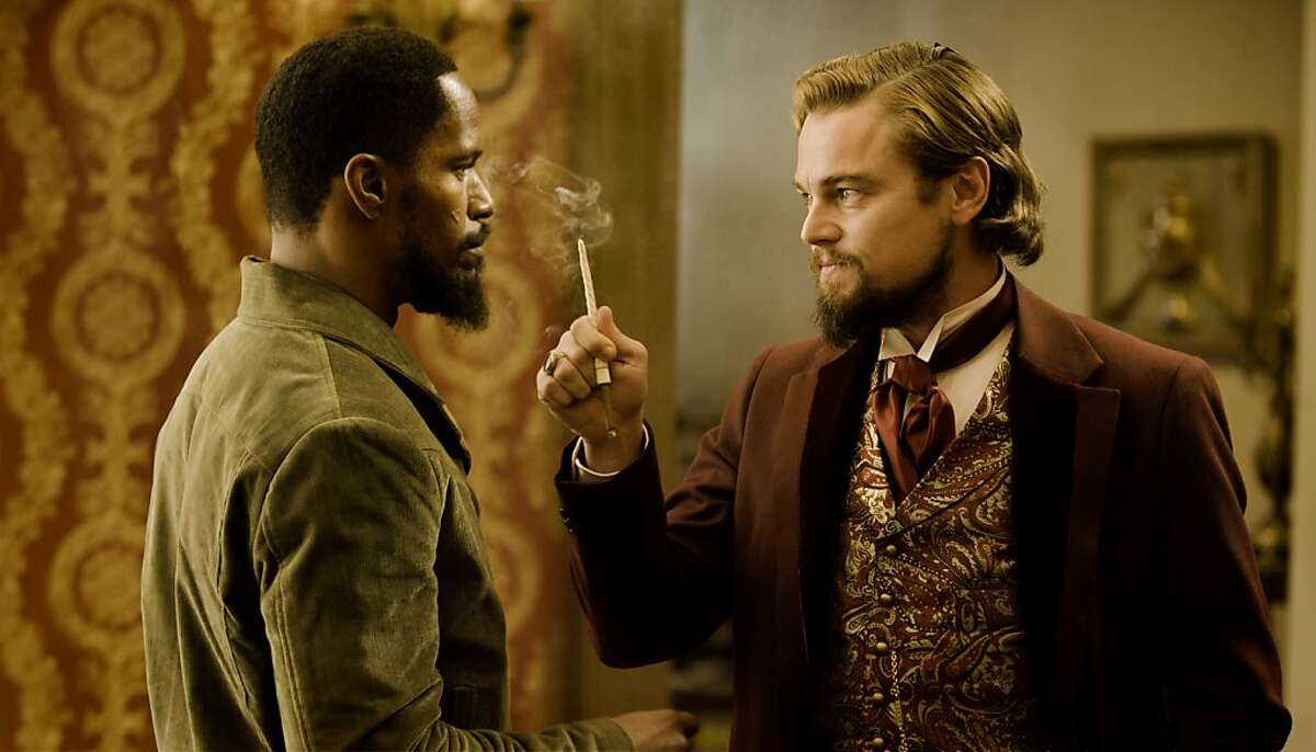 Jamie Foxx as Django and Leonardo DiCaprio as Calvin Candle in DJANGO UNCHAINED
