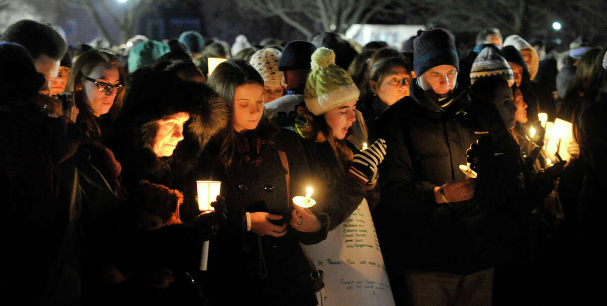 Mourners attend the vigil at Fairfield Hills Campus in Newtown on Friday, Dec. 21, 2012, one week after the shooting at Sandy Hook Elementary School.