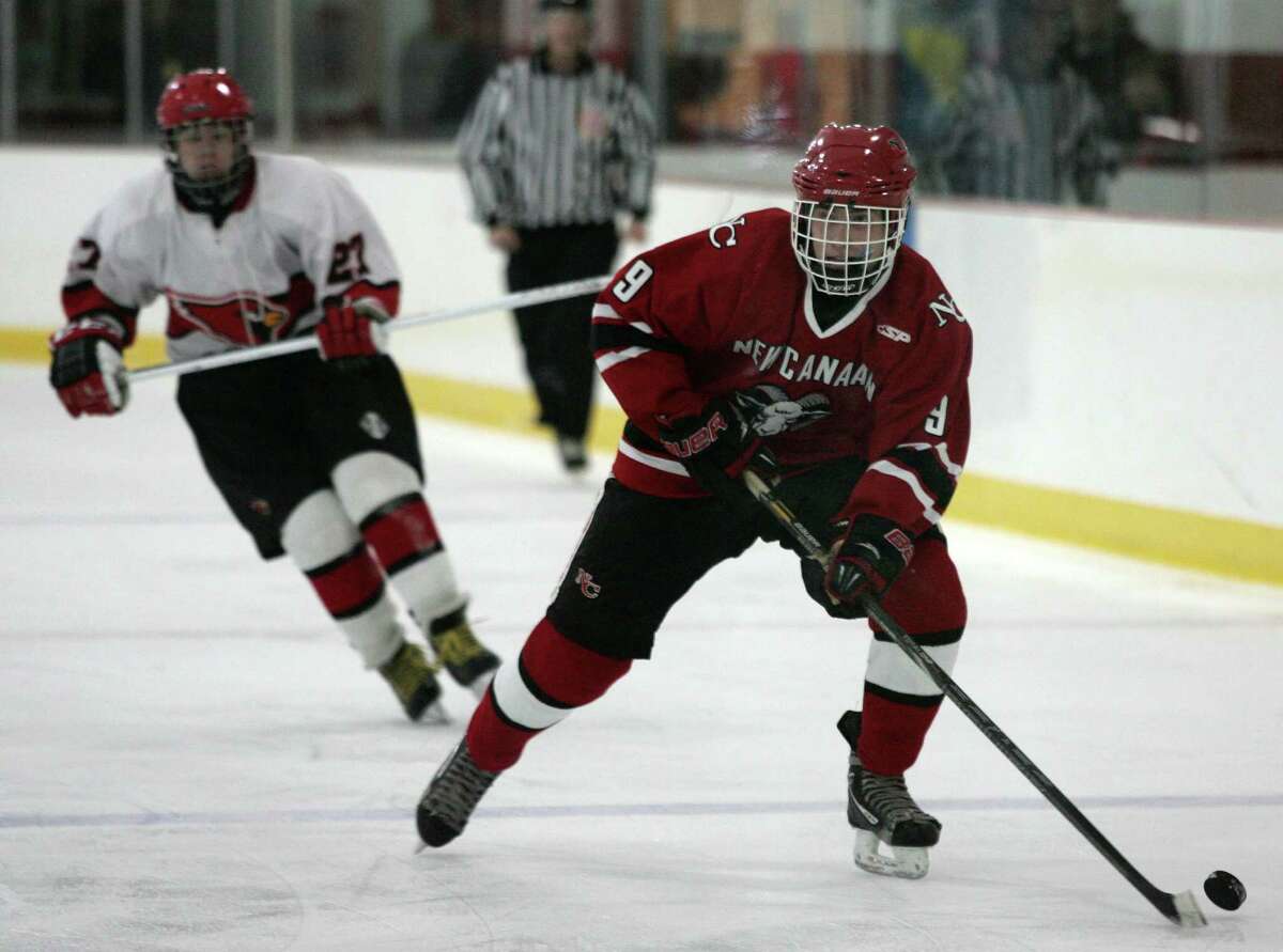 The Greenwich High School Cardinals clashed with the New Canaan Rams at Hamill Rink Saturday, Dec. 22, 2012. New Canaan went on to win 4-2.