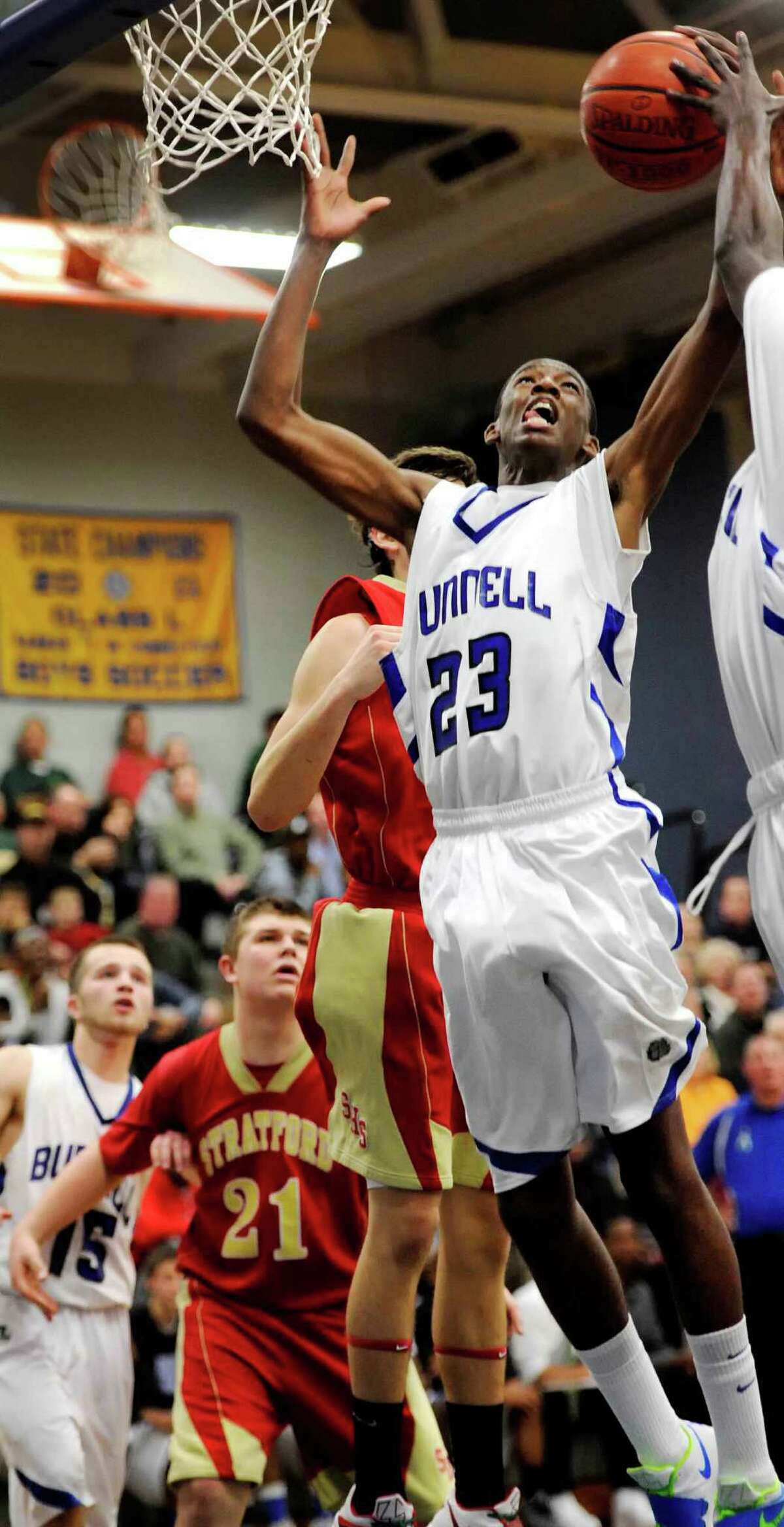 Bunnell high school's Issac Vann goes up for a rebound in a boys basketball game against Stratford high school played at Bunnell high school, Stratford, CT on Saturday, December 22nd, 2012.