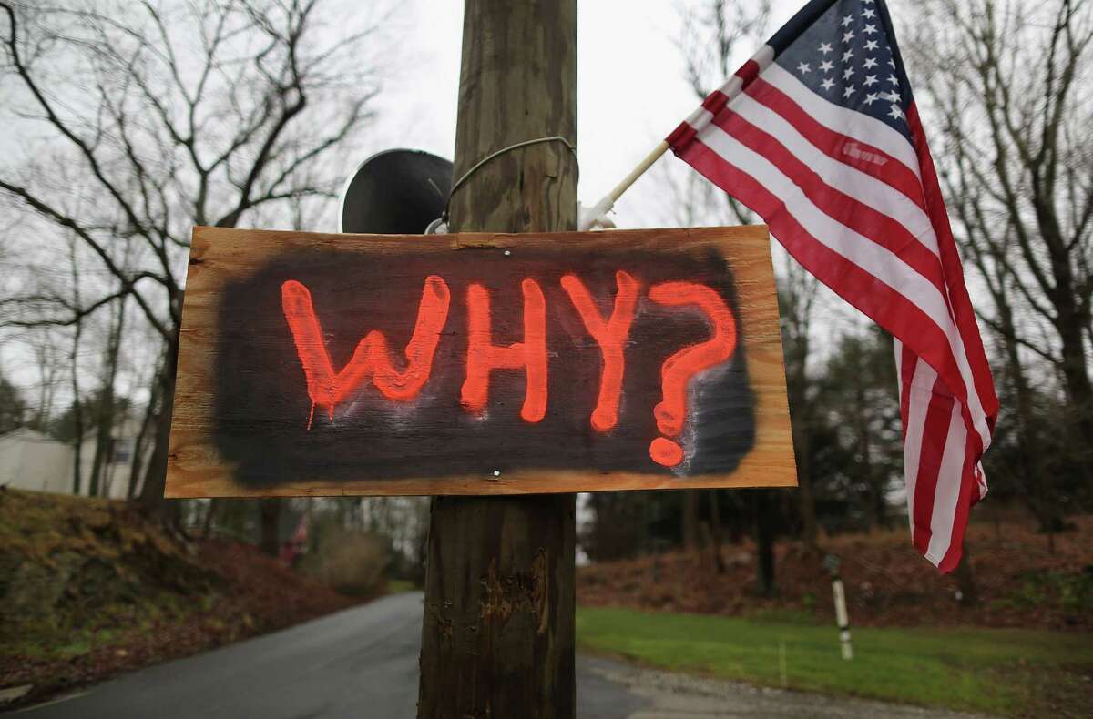 NEWTOWN, CT - DECEMBER 18: A sign hangs near a cemetery where shooting victim Jessica Rekos was to be buried on December 18, 2012 in Newtown, Connecticut. Funeral services were held in Newtown Tuesday for Jessica Rekos and James Mattioli, both age six, four days after 20 children and six adults were killed at Sandy Hook Elementary School. (Photo by John Moore/Getty Images)