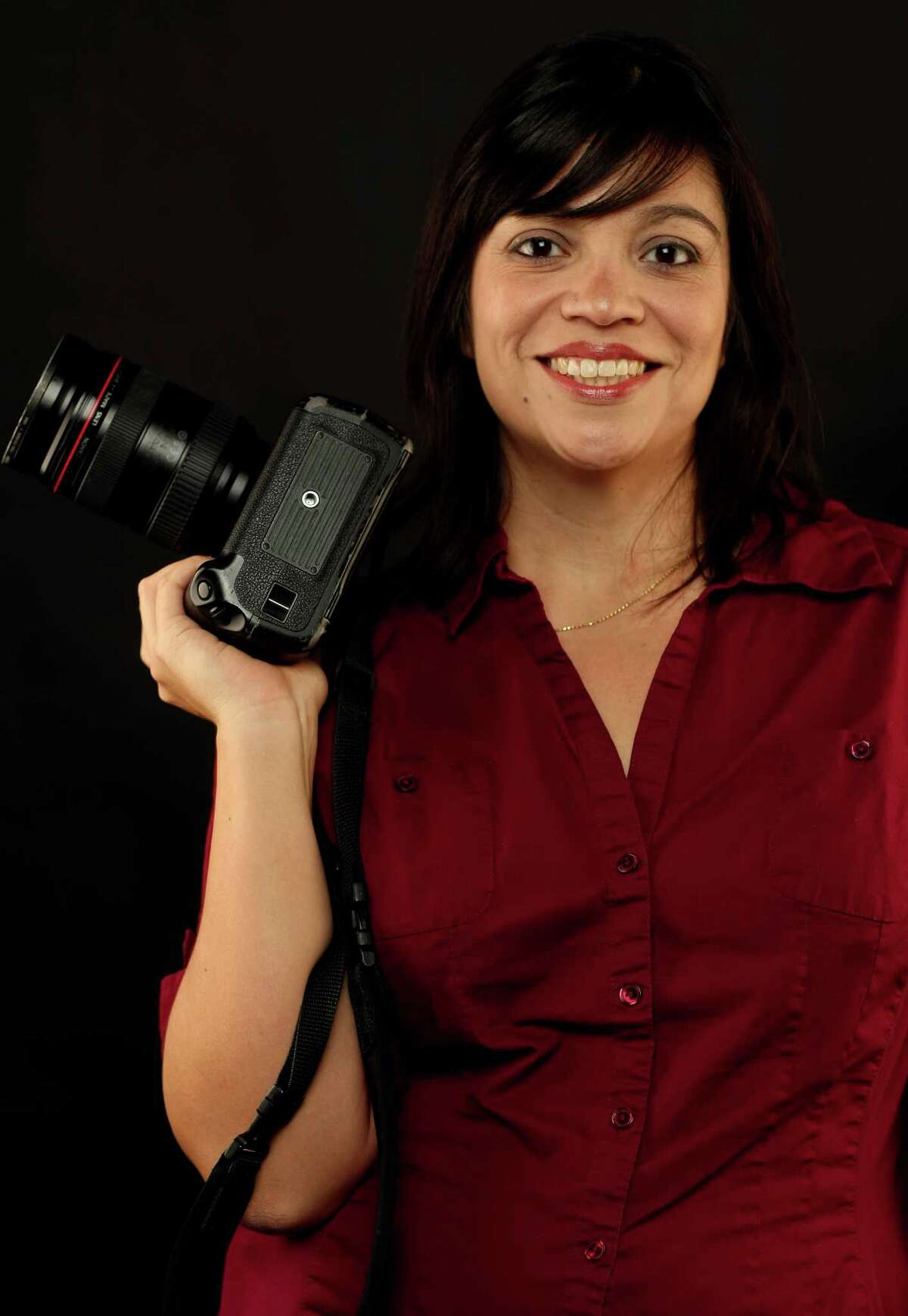 Staff photographer Helen L. Montoya.