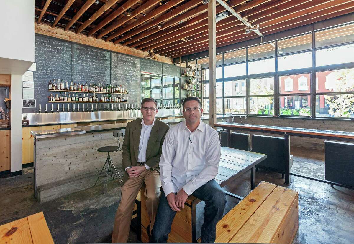 Larry Margolis, left, and Ian Rosenberg were leaders in converting a 1915 building at 1011 McGowen into a craft beer and cocktail bar called Mongoose versus Cobra. "I don't want what we do to slap you in the face and say 'look at me,' " Rosenberg says.