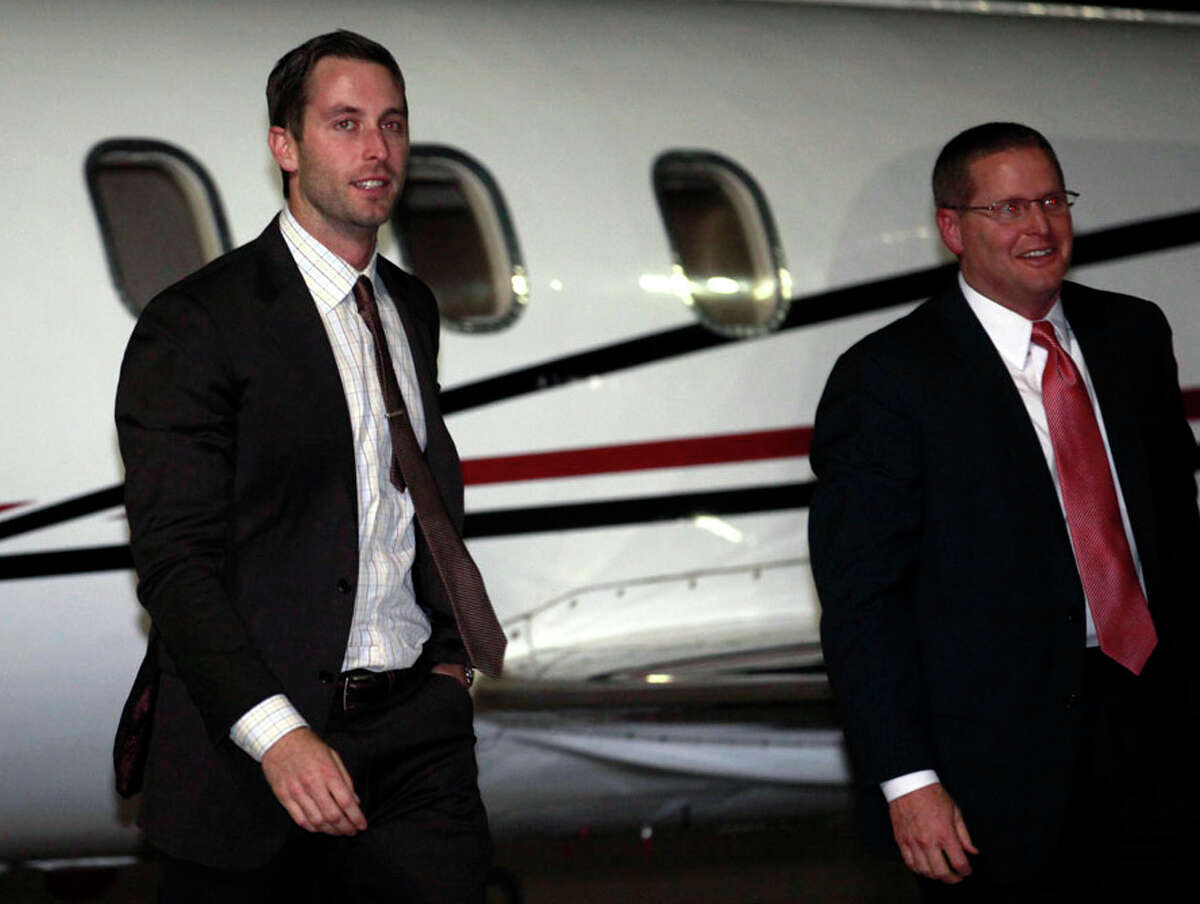 New Texas Tech coach Kliff Kingsbury, left, and athletic director Kirby Hocutt exit a plane at Lubbock International Airport in Lubbock, Texas, Wednesday, Dec. 12, 2012. Kingsbury was announced as the new Texas Tech head football coach on Wednesday. (AP Photo/The Avalanche-Journal, Stephen Spillman) ALL LOCAL TV OUT