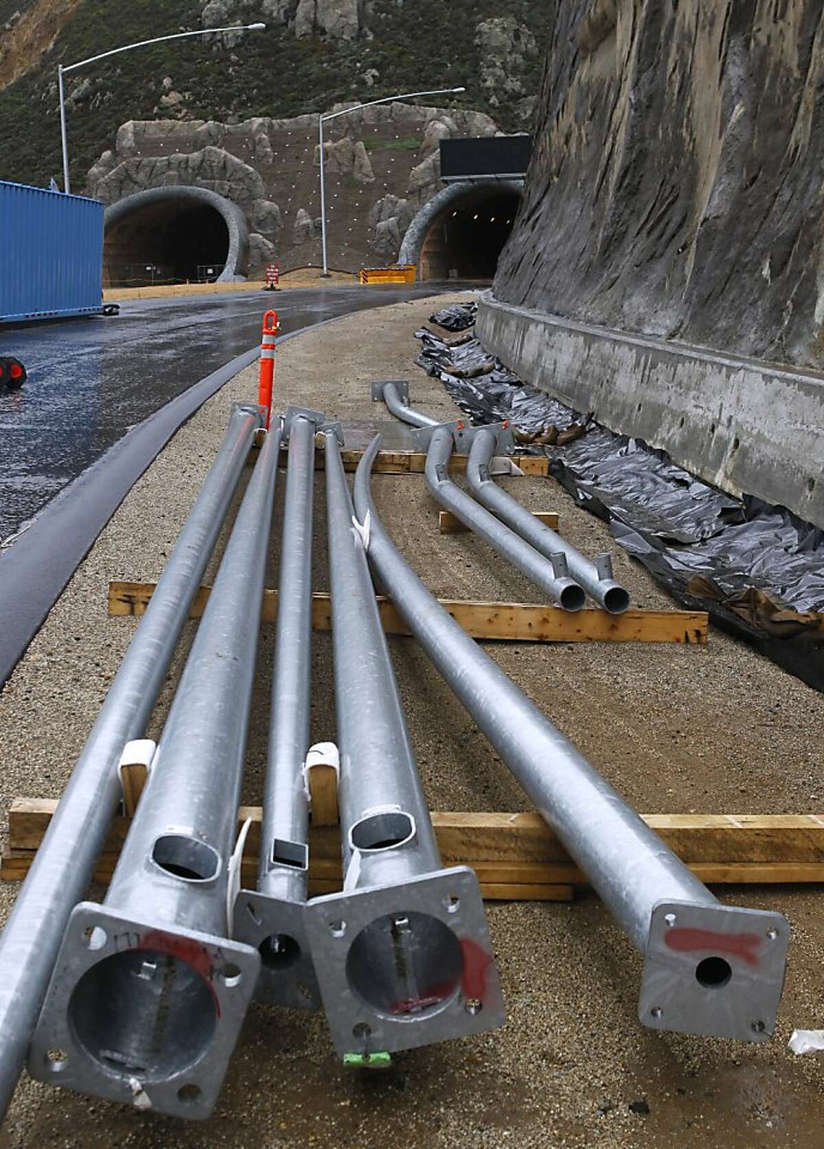 Utility poles wait to be installed on the south end of the Devil's Slide Tunnel project in Pacifica, Calif. on Friday, Dec. 21, 2012. Caltrans plans to open the twin bores early next year.