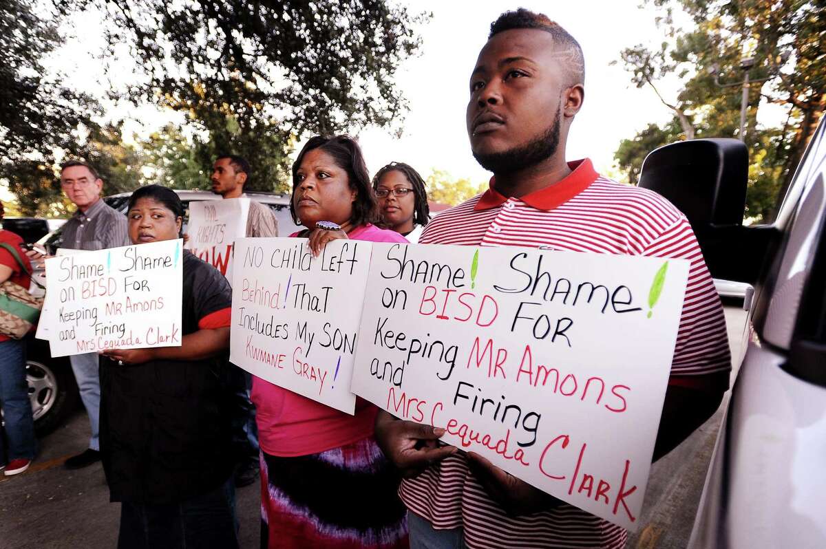 Kwmane Gray, right, was not able to enroll for the adult cosmetology class at Taylor Career Center and is protesting with other friends and family outside the BISD board meeting on Thursday, September 20, 2012. Photo taken: Randy Edwards/The Enterprise