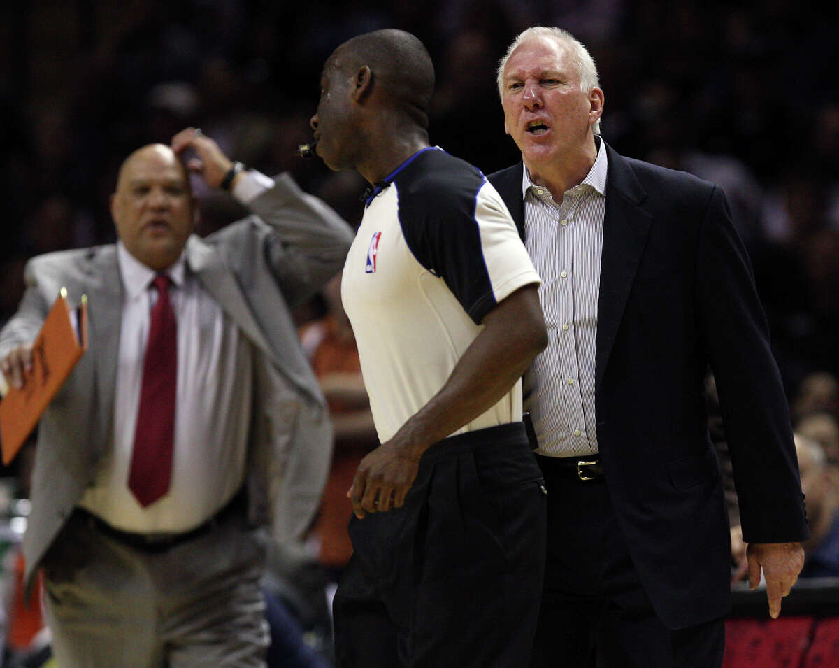 San Antonio Spurs Head Coach Gregg Popovich argues a call with official James Williams before he is ejected during the second half against the New York Knicks at the AT&T Center, Wednesday, March 7, 2012. The Spurs won 118-105. In back is Assistant Coach Don Newman.