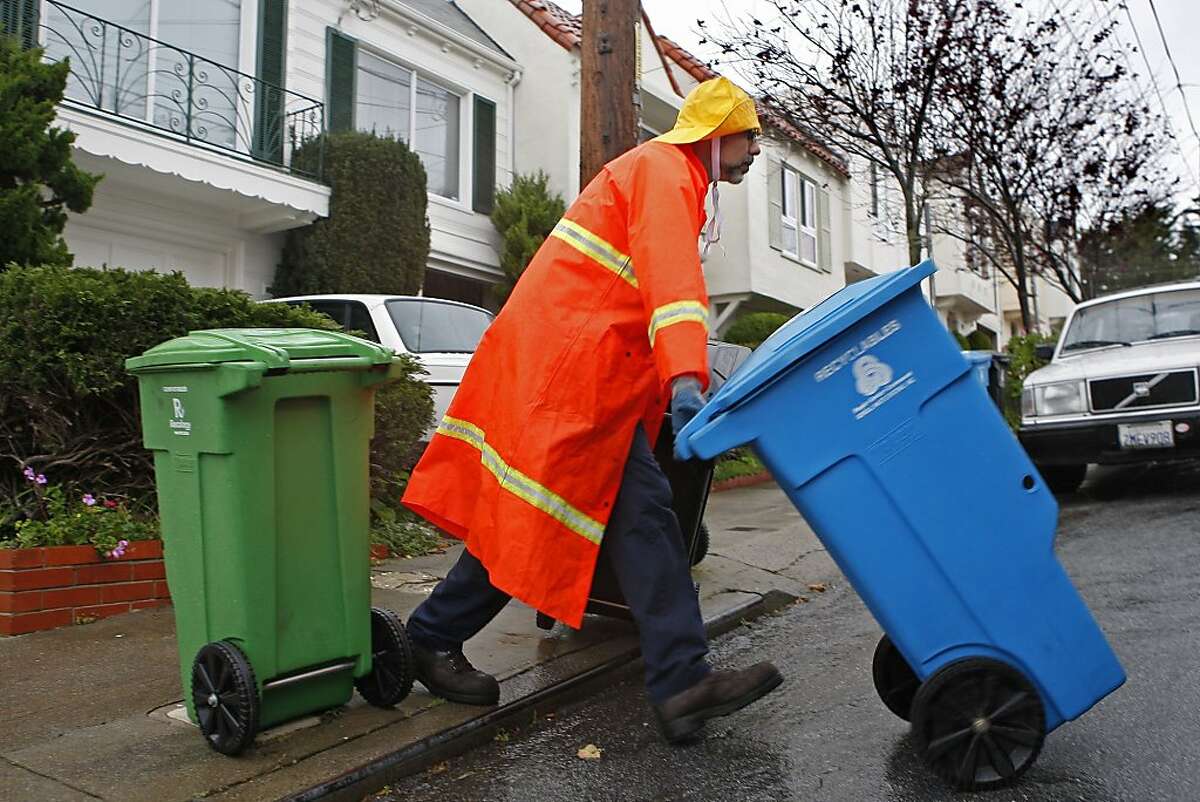 Recology employee, Wayne Belaski, age 47, does recycling and trash pickups along 26th Ave. on December 21, 2012 in San Francisco, Calif. San Francisco residents may have to begin paying for the now free green and blue recycling and compost bins.