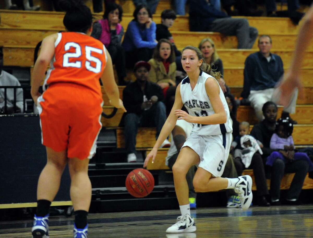 Staples' #22 Nicole Bukovsky drives the ball, during girls basketball action against Danbury in Westport, Conn. on Wednesday December 5, 2012.