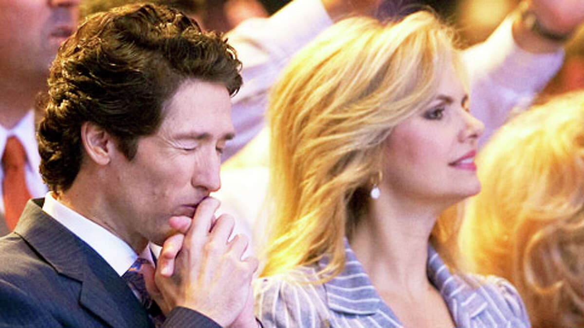 Lakewood Church Pastor Joel Osteen, left, stands next to his wife Victoria Osteen, who's the Church's Co-Pastor, as singers and the band perform on stage during his 11 a.m. service, Sunday, Aug. 28, 2011, in Houston.Learn more about the Lakewood Church pastor with our "Joel Osteen: By the numbers ..."