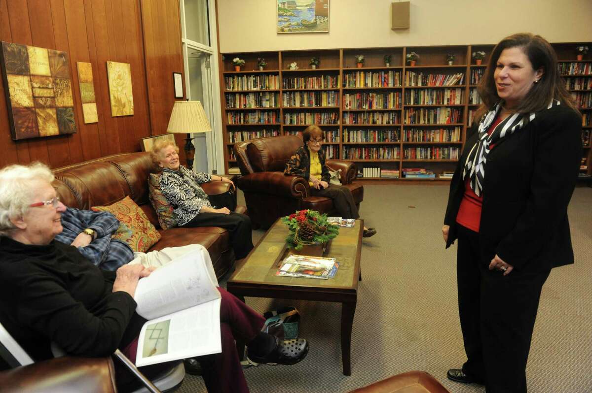 Lori Ann Contadino, the new director of the Commission on Aging, spoke with seniors at the library at the Senior Center in Greenwich, Conn., Thursday, Dec. 27, 2012.