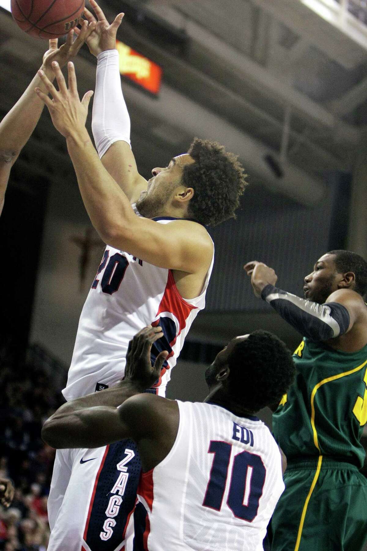 Gonzaga's Elias Harris, left, goes after a rebound during the first half of an NCAA college basketball game against Baylor in Spokane, Wash., on Friday, Dec. 28, 2012. (AP Photo/Young Kwak)