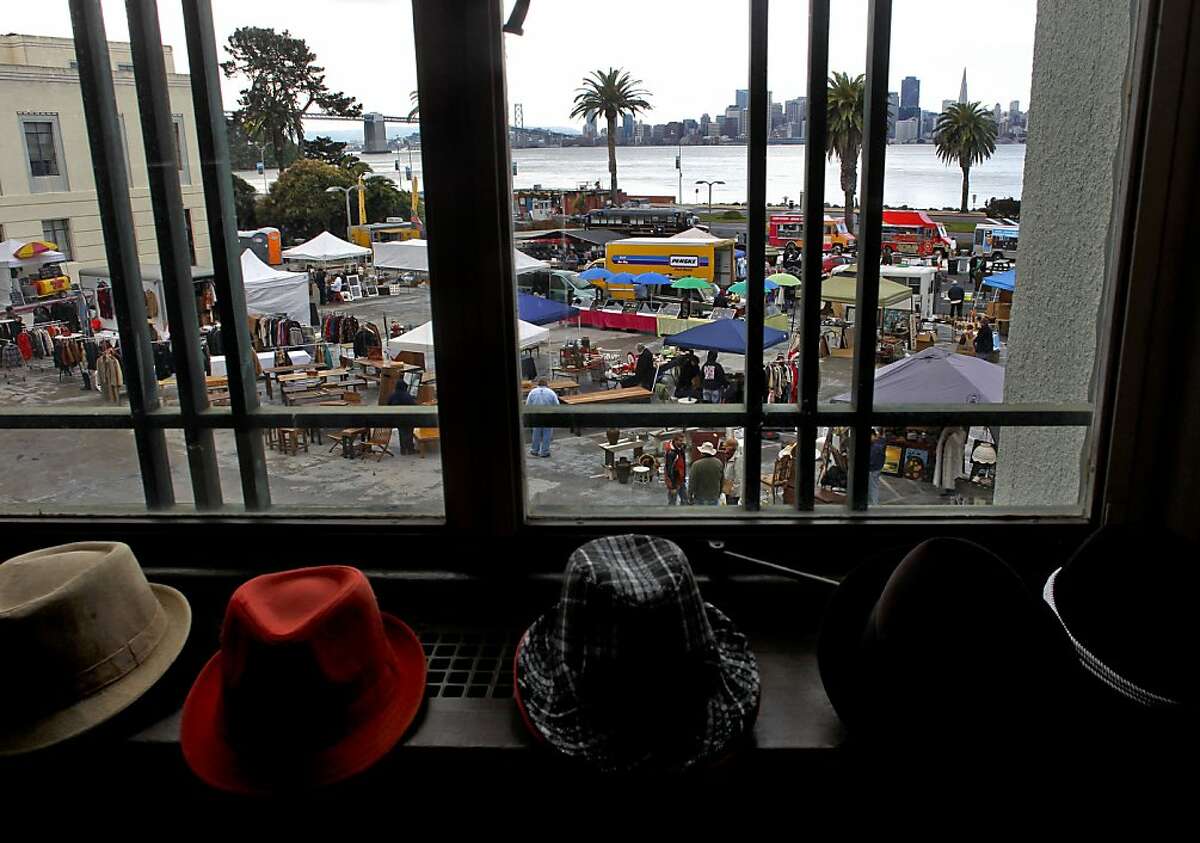 Hats from S&G Enterprise Vintage Clothing out of Redwood City, line to window sills in the inside area of the Treasure Island Flea in San Francisco, Calif. on Saturday Dec. 29, 2012.