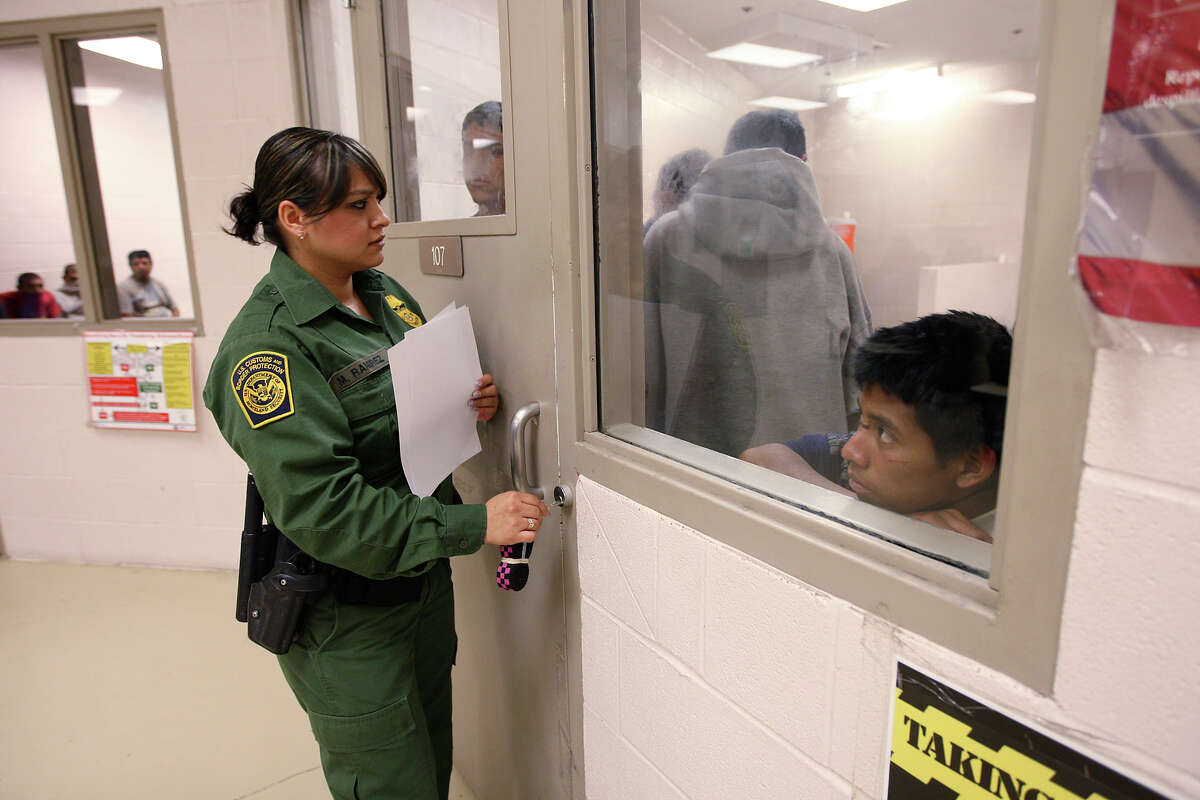 Border Patrol Agent Mari Ramirez prepares to open a holding cell for roll call at the Falfurrias station. The latest official statistics for the sector show apprehensions surged more than 60 percent from 2011 to 2012 for comparable 10-month periods.