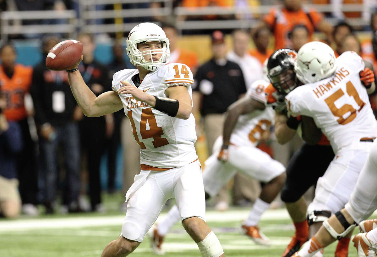 Texas quarterback David Ash drops back for a pass against Oregon State in the first half of the Valero Alamo Bowl on Saturday, Dec. 29, 2012.