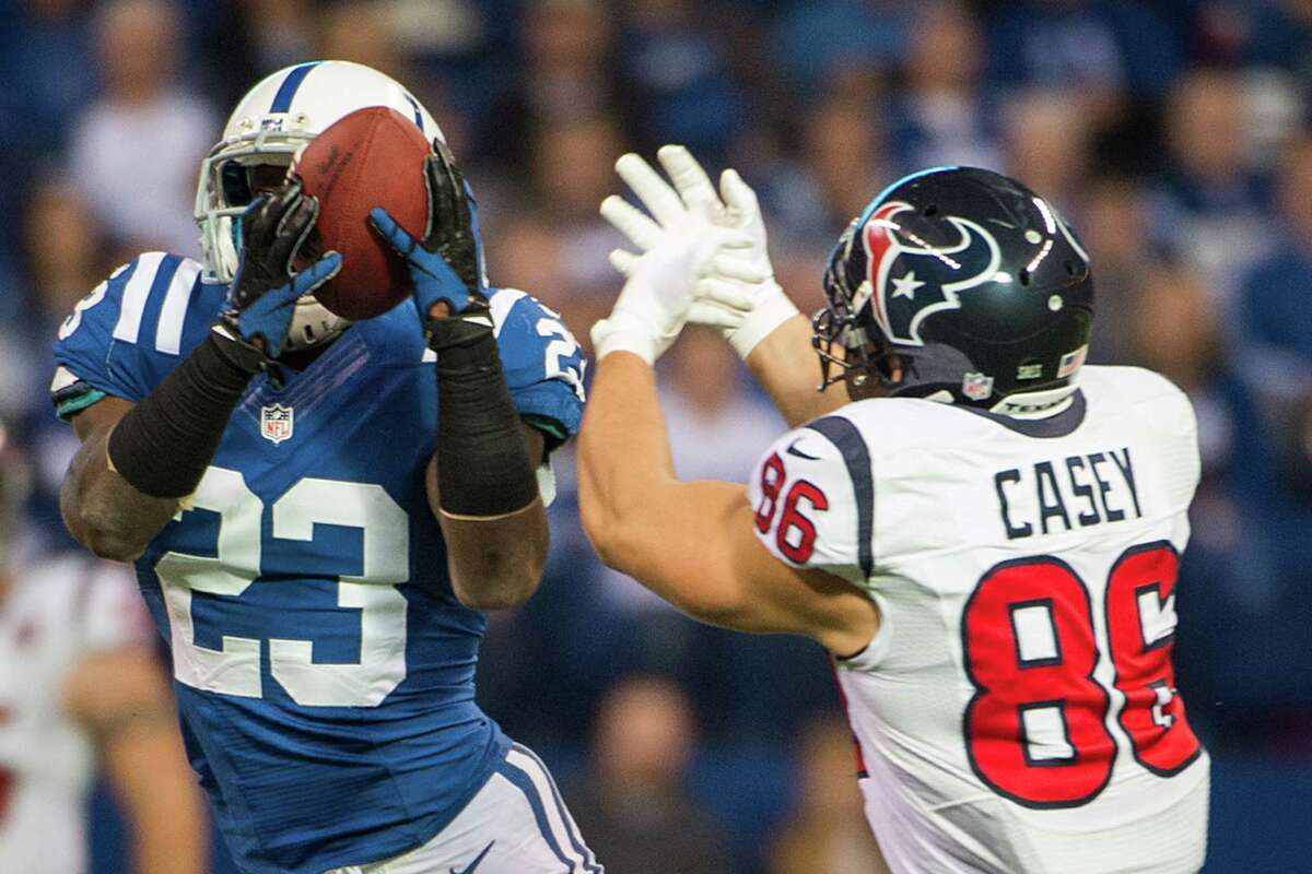 Colts cornerback Vontae Davis (23) intercepts a pass intended for Texans fullback James Casey (86) during the second quarter.