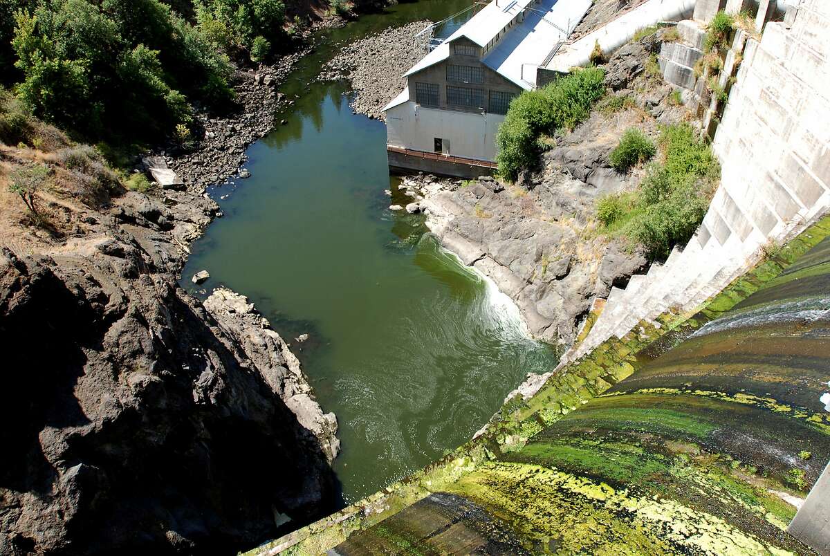 Water trickling over Copco 1 Dam on the Klamath River outside Hornbrook, Calif. A companion agreement to the historic deal to remove four dams from the Klamath River has been renewed, giving supporters another two years to try to get Congress to pay for it. Supporters of the Klamath Basin Restoration Agreement announced Monday that all 24 signatories _ including Indian tribes, local governments, irrigation districts, salmon fishermen and conservation groups _ agreed to renew. (AP Photo/Jeff Barnard, File)