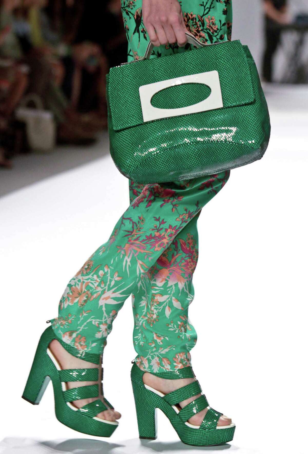 FILE - This Sept. 12, 2012 file photo shows fashion from the Spring 2013 collection of Nanette Lepore in New York. The rich, vibrant shade of emerald green is Pantone LLC's Color of the Year for 2013, beating out all the other shades of the rainbow. (AP Photo/Bebeto Matthews, file)
