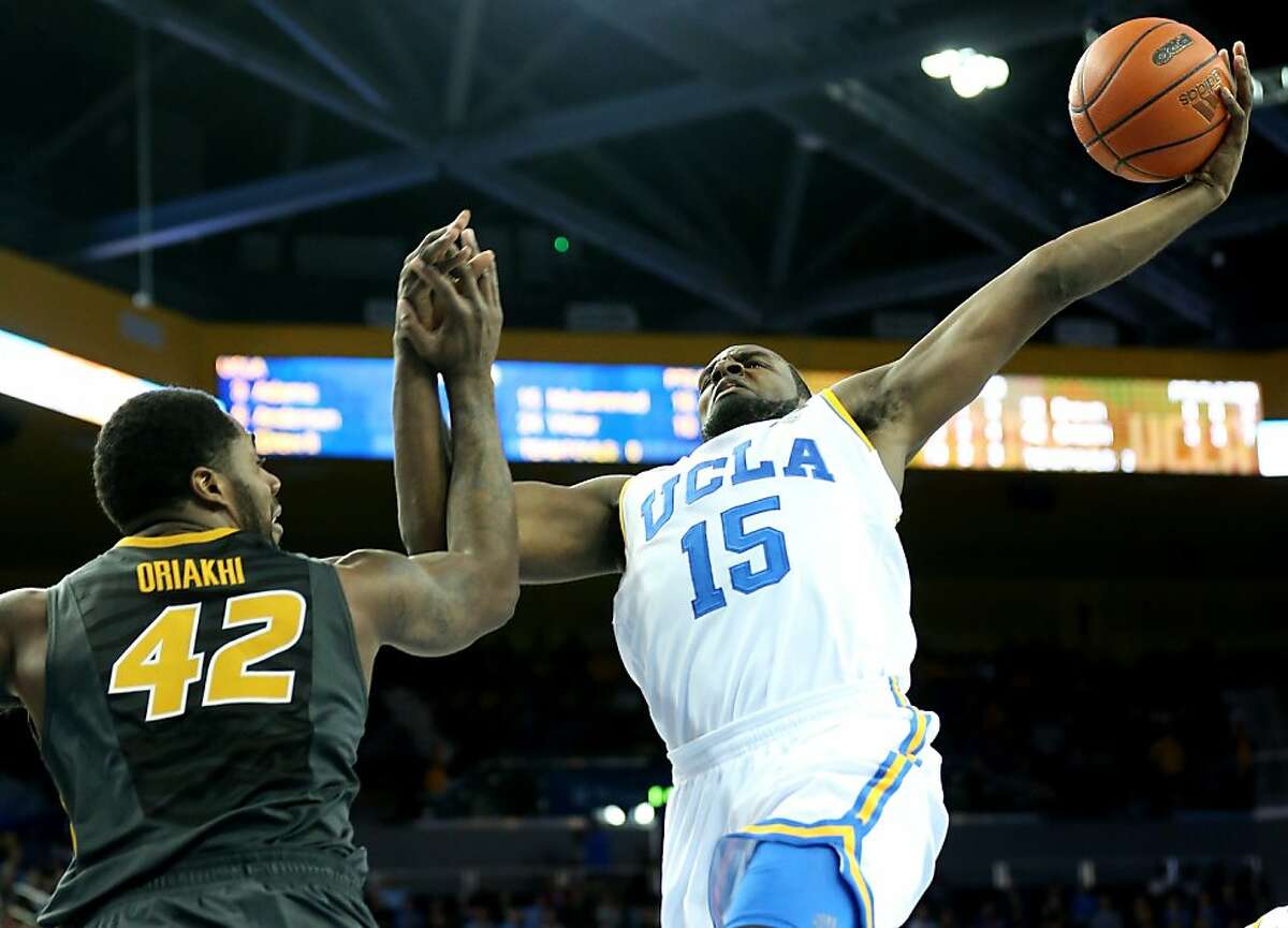 LOS ANGELES, CA - DECEMBER 28: Shabazz Muhammad of the UCLA Bruins goes up for a shot over Alex Oriakhi #42 of the Missouri Tigers at Pauley Pavilion on December 28, 2012 in Los Angeles, California. UCLA won 97-94 in overtime. (Photo by Stephen Dunn/Getty Images)