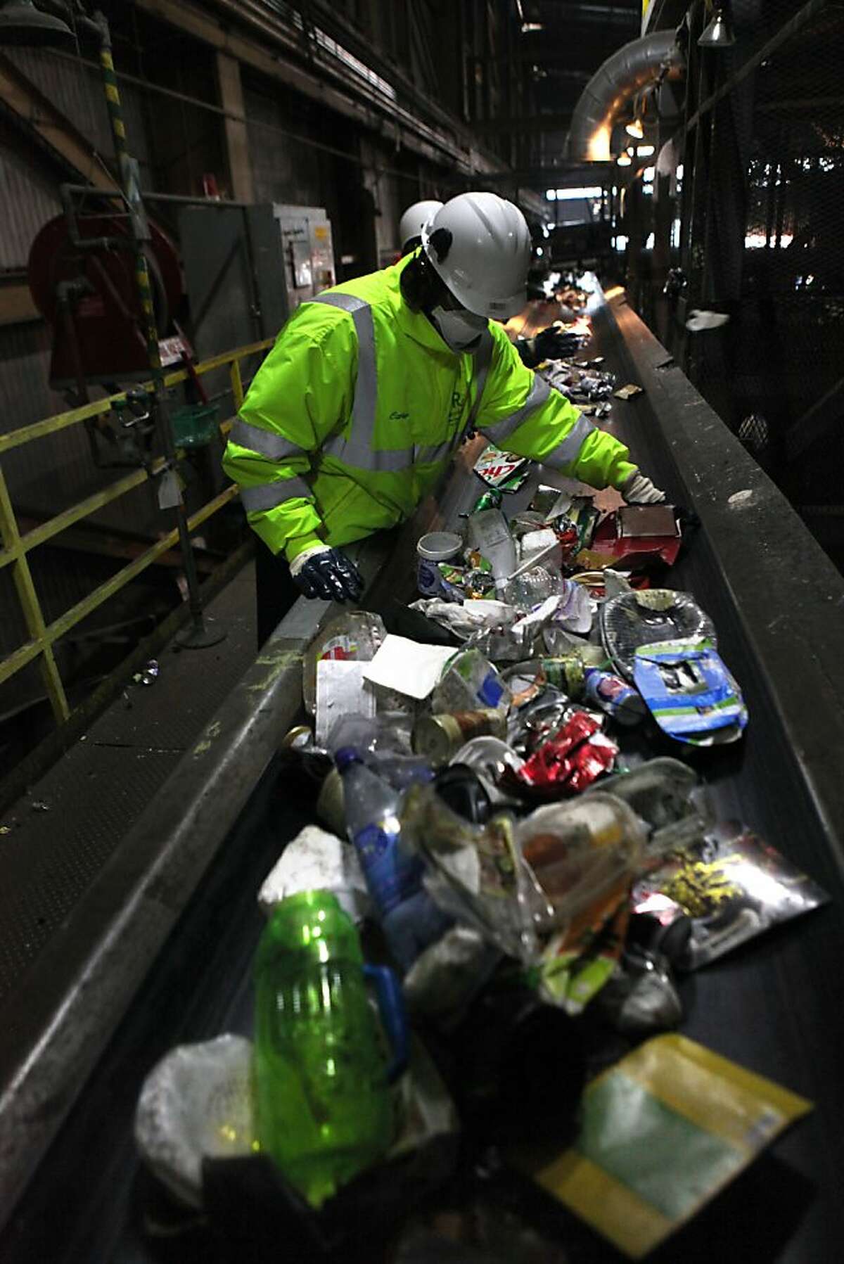 Recology staff sorting paper, cans, and plastics at the Recycle Center @ Pier 96 in San Francisco, California, on Wednesday, January 2, 2012.