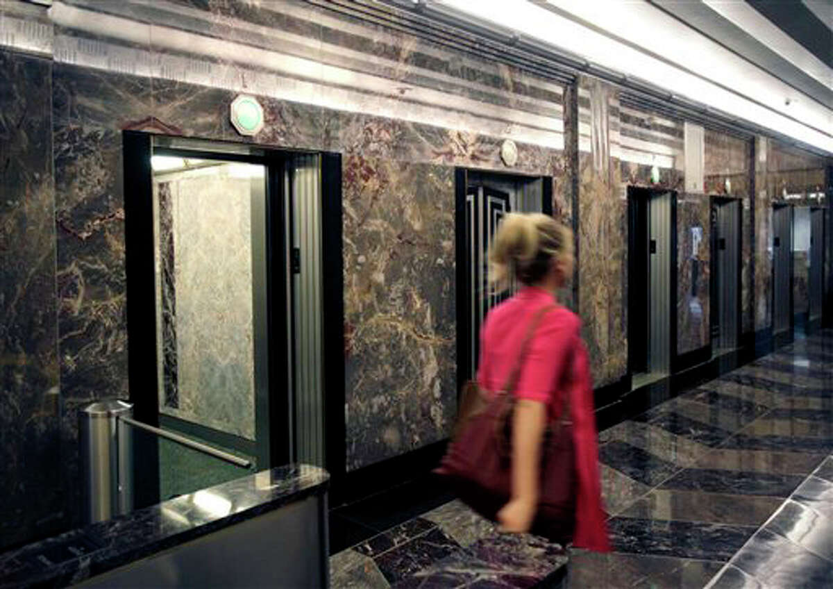 Double-deck elevators rise as taller buildings test limits