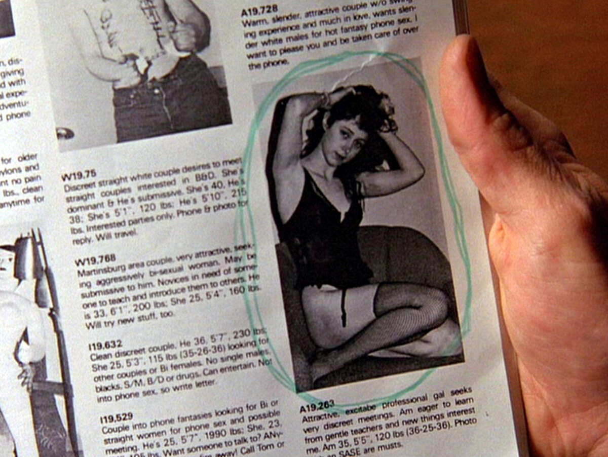 The hand of an unidentified actor holds a newspaper which features a photo of Ronette Pulaski (as played by Phoebe Augustine) from a sexually explicit personals column in a scene from the pilot episode of the television series 'Twin Peaks,' originally broadcast on April 8, 1990. (Photo by CBS Photo Archive/Getty Images)